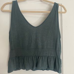 Lightweight and cropped sage green peplum style tank top from Pac Sun